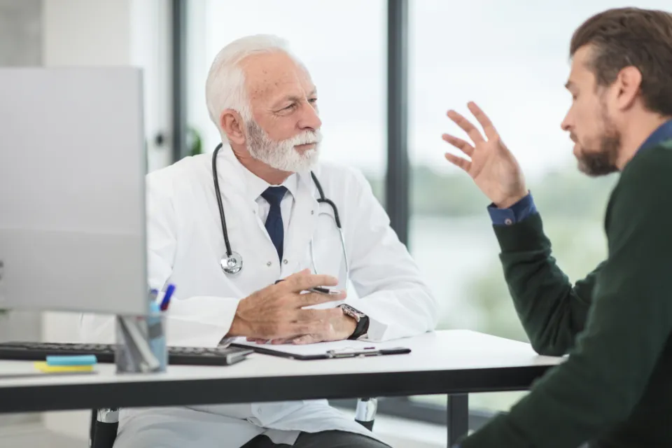 A doctor talking with a patient in a bright clinic