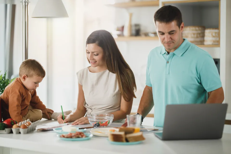 A family having breakfast together at the kitchen table